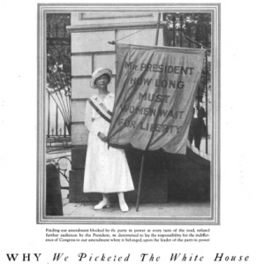 Suffragist holding protest sign, Good Housekeeping, 1918.