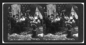 Photograph of people playing cards in a parlor in about 1906.