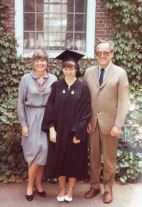 Photograph of Mary Grace McGeehan graduating from Harvard, with parents, 1983.