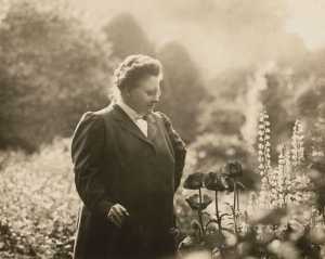 Poet Amy Lowell in her garden, ca. 1916.