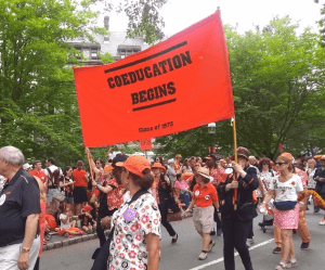Princeton P-rade banner, Coeducation Begins.