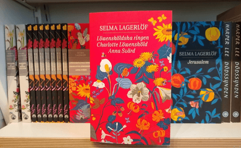 Books by Selma Lagerlof on a bookshelf.