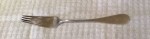 Tarnished silver fork.