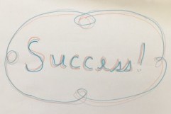 Handwritten Success! surrounded by squiggle.