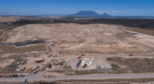 Photograph of Cape Town landfill site with Table Mountain in the background.