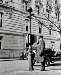 Photograph of policeman at call box, Washington, D.C., 1910s.