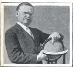 Halbert Gillette pointing to globe, Popular Science, 1930.