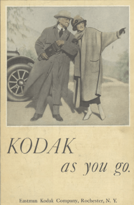 Kodak ad, man and woman next to car, Ladies' Home Journal, 1920.