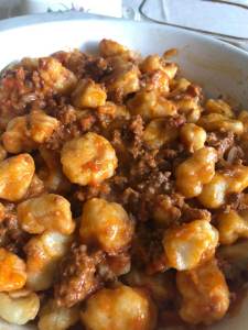 Gnocci with meat sauce.
