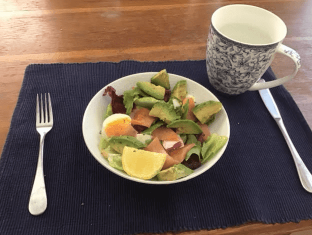 Smoked salmon salad with avocado and egg.
