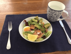 Smoked salmon salad with avocado and egg.